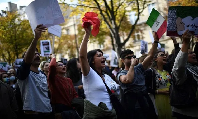 Iran police warn protesters of harder action