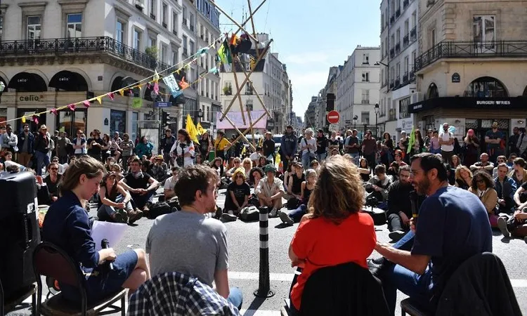 Climate activists block IMF Paris office doors