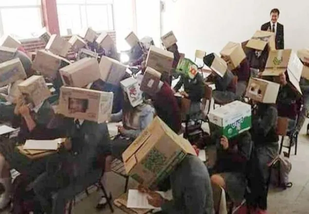 নকল ঠেকাতে পরীক্ষার্থীদের মাথায় কাগজের বাক্স