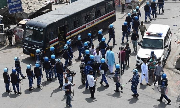 Indian police arrest 14 after communal clashes in New Delhi