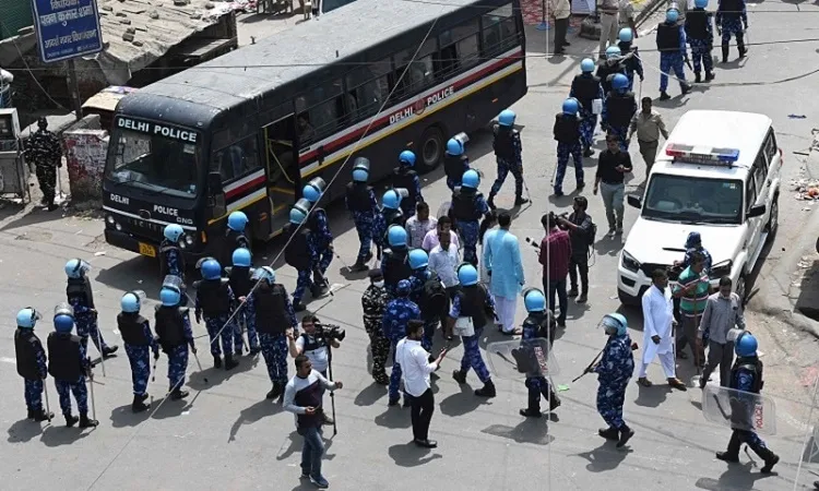 Indian police arrest 14 after communal clashes in New Delhi