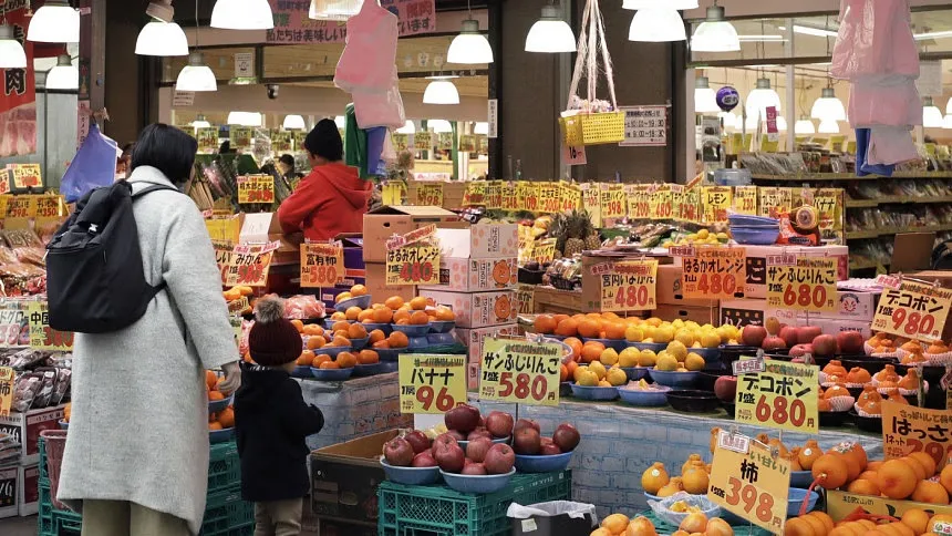 Japan cuts Q2 GDP on weak spending, wages slide