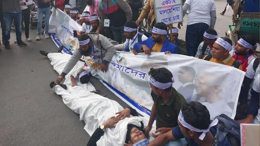 Malaysia-bound workers block road in Karwan Bazar