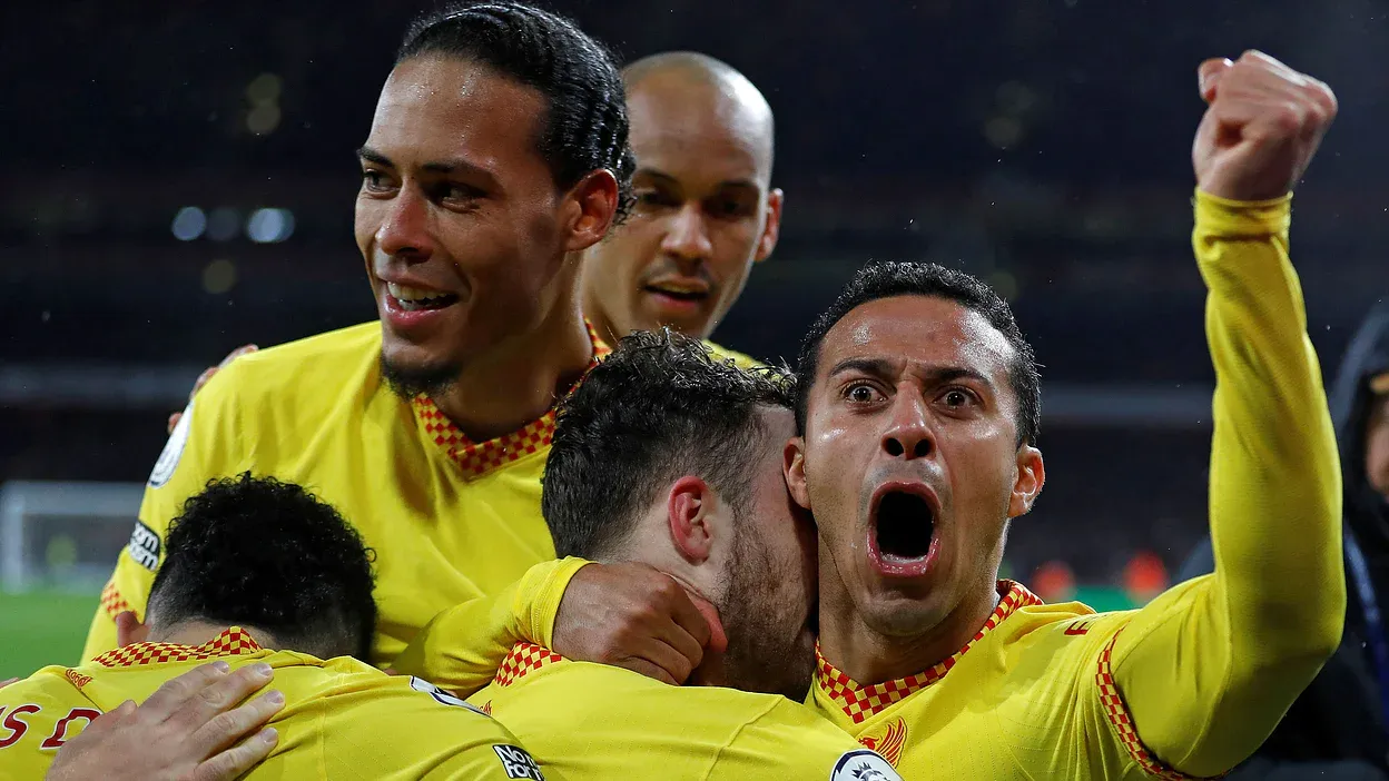 Liverpool sink Arsenal to boost title bid