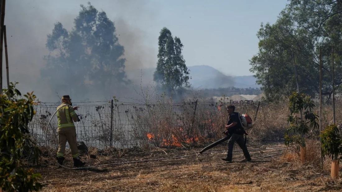 Hezbollah fires big rocket salvos at Israel after senior commander killed