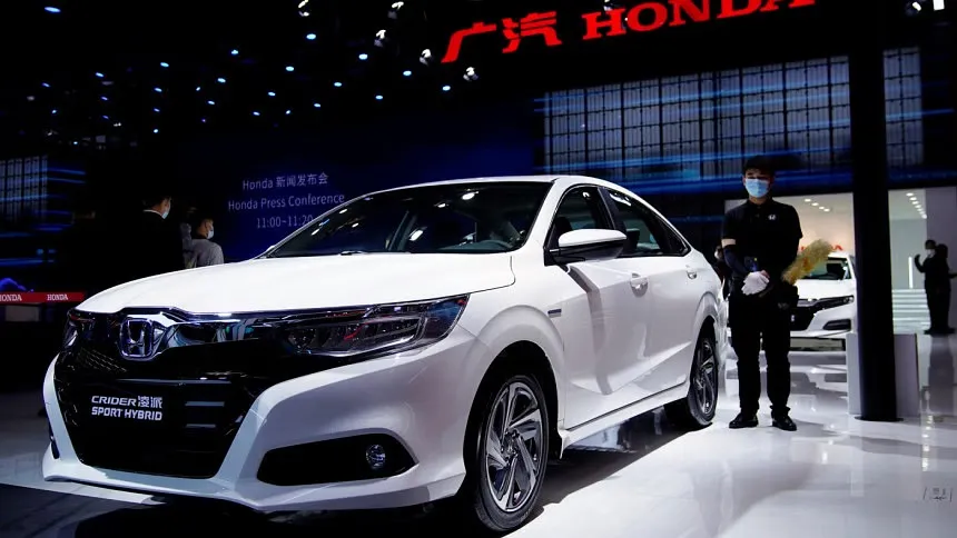 Honda posts record profit, issues cautious forecasts
