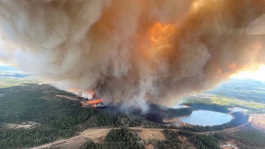 Wildfires in Western Canada force thousands to flee