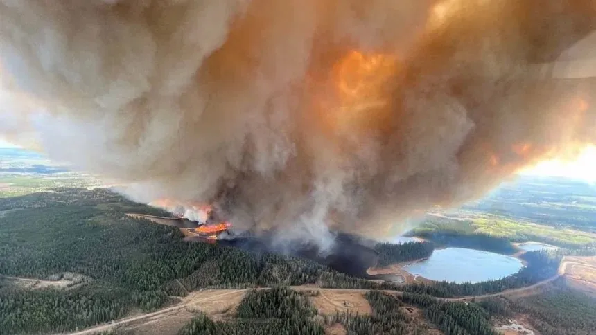 Wildfires in Western Canada force thousands to flee