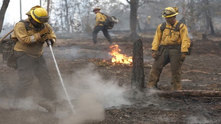 Firefighters tackle California wildfire as heat grips parts of US
