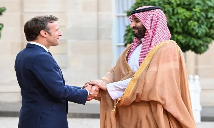 Macron defies anger to welcome Saudi strongman