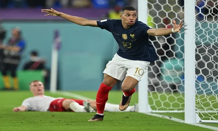 Mbappe double puts holders France into last 16
