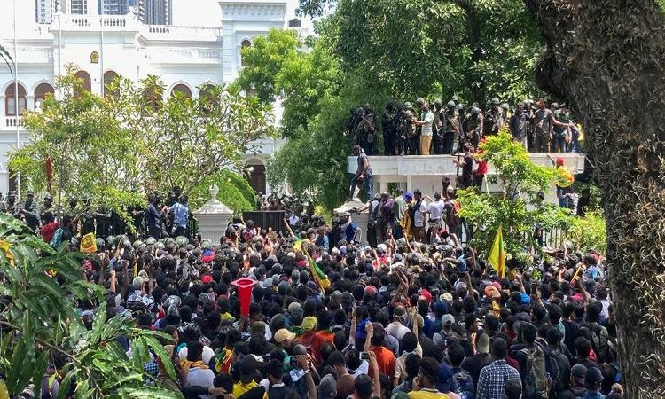 Sri Lankan president flees to Maldives, protesters storm PM's office